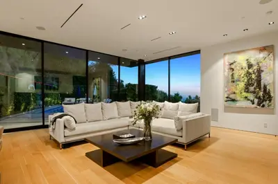 a living room with a couch and a table at Belfast Estate in Los Angeles