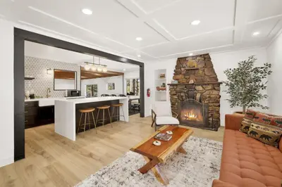 a living room with a couch and a fireplace at Vista Pines at Big Bear Lake– Your Ultimate Mountain Escape in Big Bear Lake