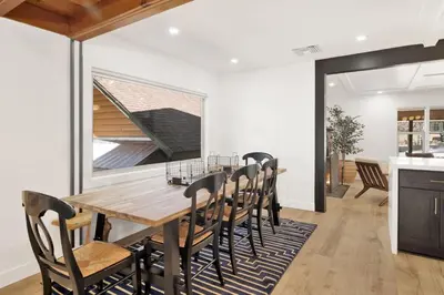 a dining room with a wooden table and chairs at Vista Pines at Big Bear Lake– Your Ultimate Mountain Escape in Big Bear Lake