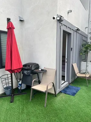 a patio with a grill and a table and chairs at Luxury guest suite in Los Angeles in North Hills
