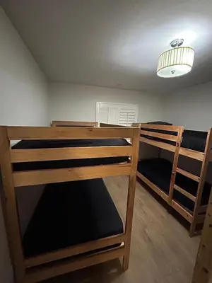 two bunk beds in a room with a ceiling at Santa Ana Vibes in Santa Ana