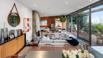 a living room with a couch and a table at Waynecrest in Los Angeles