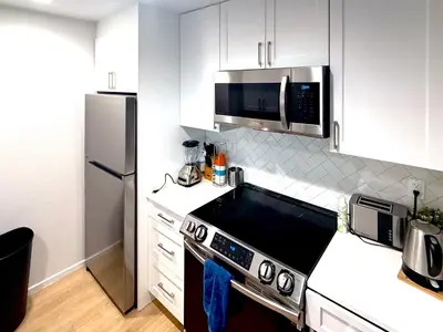 a kitchen with a stove and a refrigerator at Great 2 Bedroom and 2 Bathroom Apartment in Marina in Los Angeles
