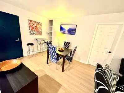 a living room with a table and chairs at Great 2 Bedroom and 2 Bathroom Apartment in Marina in Los Angeles