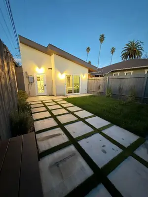 a backyard of a house with a fence at Perfect and relaxing Couple retreat in the heart of Los Angeles in Los Angeles