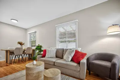 a living room with a couch and a table at Luxury Cozy 2BR 1BA near LAX, LMU, SoFi Stadium, Beach in Los Angeles