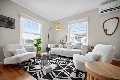 a living room with a couch and chairs and a table at Cozy Modern 2BR 1BA near LAX, LMU, SoFi Stadium and the Beach in Los Angeles
