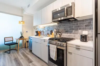 a kitchen with a stove and a microwave at Boutique Mini 1 BD Residence in Los Angeles