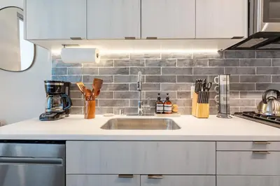 a kitchen with a sink and a counter top at Boutique Mini 1 BD Residence in Los Angeles