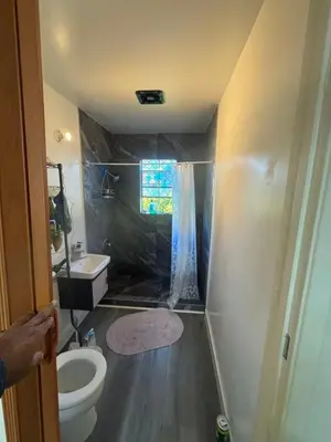 a small bathroom with a toilet and a sink at Long Beach vocation home in Long Beach