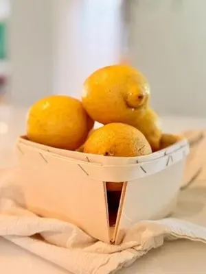 a basket of lemons and pears on a table at The Chapel - Luxury Historic Ojai Villa in Ojai