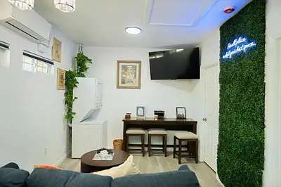 a living room with a couch and a table at Modern Guesthouse ADU Sanctuary in San Bernardino