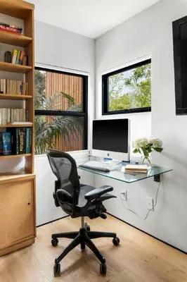 an office with a desk with a computer and a chair at Brooks Beach House Your Venice Escape in Los Angeles