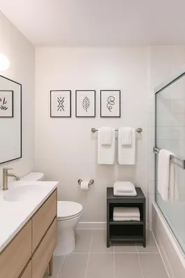 a white bathroom with a toilet and a sink at Modern 1Bed in Koreatown- Pool, Sauna & Free Parking in Los Angeles