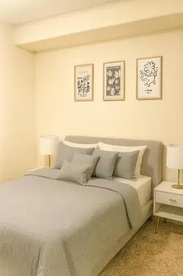 a bedroom with a large bed with two lamps at Modern 1Bed in Koreatown- Pool, Sauna & Free Parking in Los Angeles