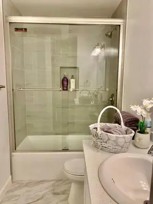 a bathroom with a shower and a toilet and a sink at Proper Stays at Melrose - West Hollywood Premium E suite in Los Angeles
