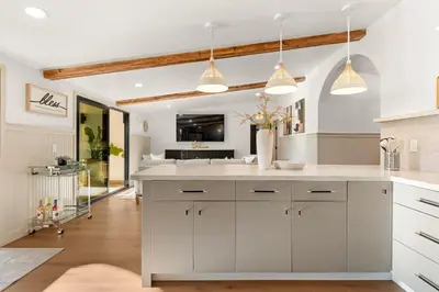 a kitchen with white cabinets and white counter tops at Exclusive Disney Resort- Private Pool & Luxe Stay in Anaheim