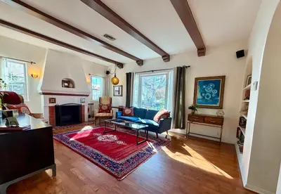 a living room with a couch and a fireplace at Culver Adjacent Spanish in Los Angeles