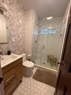 a bathroom with a shower and a toilet and a sink at Culver Adjacent Spanish in Los Angeles