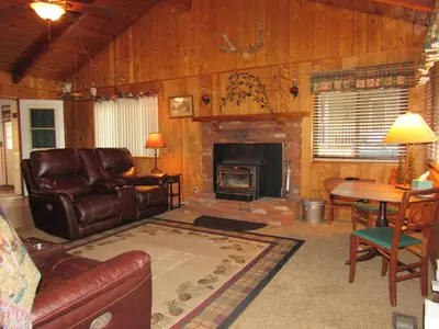 a living room with a couch and a fireplace at M & M Sweet Retreat in Big Bear Lake