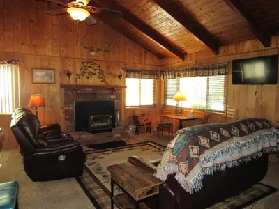 a living room with a couch and a fireplace at M & M Sweet Retreat in Big Bear Lake