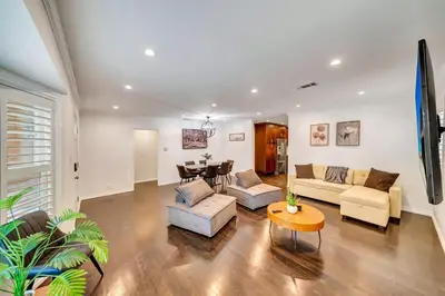 a living room with two couches and a table at Charming 3BR with Ping-Pong and Spa!