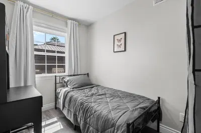 a bedroom with a bed and a window at Wonderful Home Near Claremont! With Amazing Backyard! in Pomona