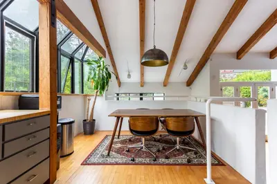 a kitchen with a table and a rug at Hillside Home with Outdoor Oasis and Pool in Sherman Oaks