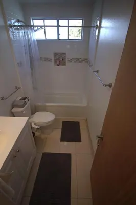 a bathroom with a tub and a toilet and a shower at Charming 1-bedroom apartment in amazing Palms, Los Angeles with AC, Parking in Los Angeles