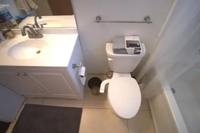 a small bathroom with a toilet and a sink at Charming 1-bedroom apartment in amazing Palms, Los Angeles with AC, Parking in Los Angeles