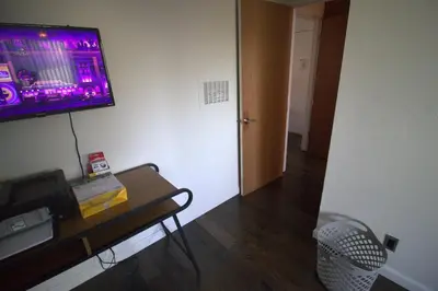 a room with a table and a tv on a wall at Charming 1-bedroom apartment in amazing Palms, Los Angeles with AC, Parking in Los Angeles