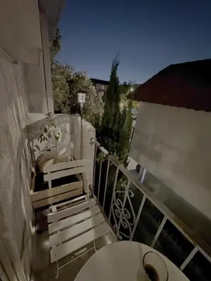 a balcony with stairs and a table on a building at Charming 1-bedroom apartment in amazing Palms, Los Angeles with AC, Parking in Los Angeles