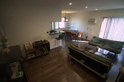 a living room with a couch and a table at Charming 1-bedroom apartment in amazing Palms, Los Angeles with AC, Parking in Los Angeles