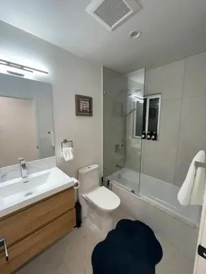 a bathroom with a sink and a toilet and a shower at 2 bedroom Cozy house in heart of Burbank in Burbank