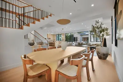 a dining room and living room with a table and chairs at Kraft Villa in Los Angeles