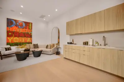 a living room with a couch and a kitchen at Kraft Villa in Los Angeles