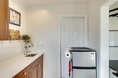 a kitchen with a sink and a refrigerator at Work and Play! Extended-Stay Studio in Simi Valley in Simi Valley