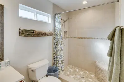 a bathroom with a toilet and a shower at Work and Play! Extended-Stay Studio in Simi Valley in Simi Valley