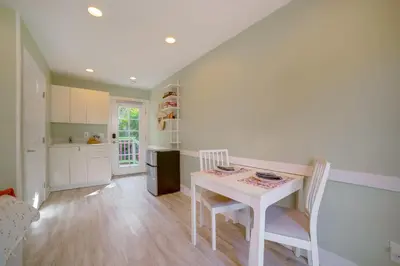 a kitchen with a table and chairs in a room at Walk to Festival of Lights Cozy Couples Retreat in Riverside