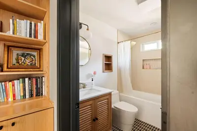 a bathroom with a sink and a toilet and a bath tub at LA Oasis with Private Yard 10 min to Beach LAX 405 in Los Angeles