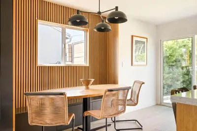 a dining room with a wooden table and chairs at LA Oasis with Private Yard 10 min to Beach LAX 405 in Los Angeles