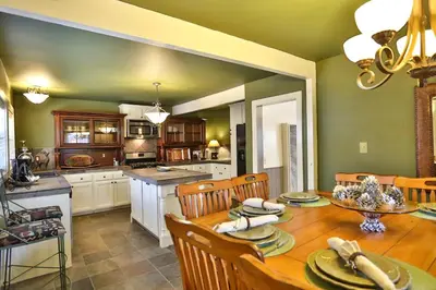 a kitchen and dining room with a table and chairs at Bear Creek Resort in Big Bear Lake