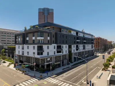 an apartment building on the corner of a street at Stylish Condo Mins to Shoreline in Long Beach