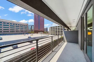 a balcony of a building with a view of a city at Stylish Condo Mins to Shoreline in Long Beach