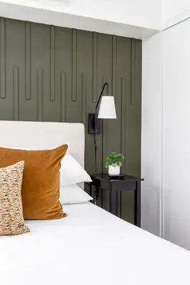 a bedroom with a white bed and a table with a lamp at Cozy LA Getaway Fast Wi-Fi and Smart TV in Los Angeles