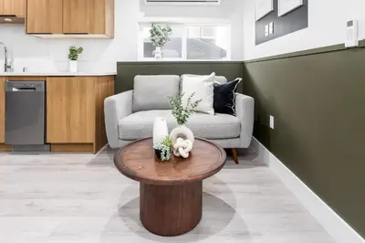 a living room with a couch and a table at Cozy LA Getaway Fast Wi-Fi and Smart TV in Los Angeles