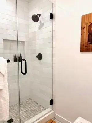 a shower with a glass door in a bathroom at Hillside Haven - Boutique Spanish Escape in Ojai