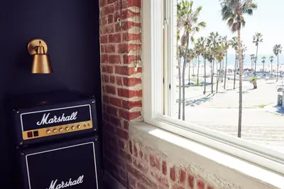 a window with a view of the beach at Venice V Hotel in Los Angeles