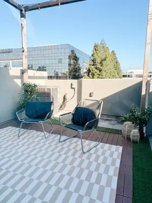 two chairs sitting on top of a patio at Central, Urban Townhouse with Private Roof Deck in Garden Grove