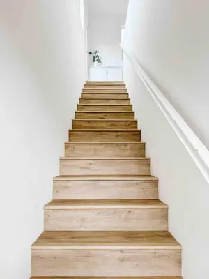 a staircase with white walls and wooden floors at Central, Urban Townhouse with Private Roof Deck in Garden Grove
